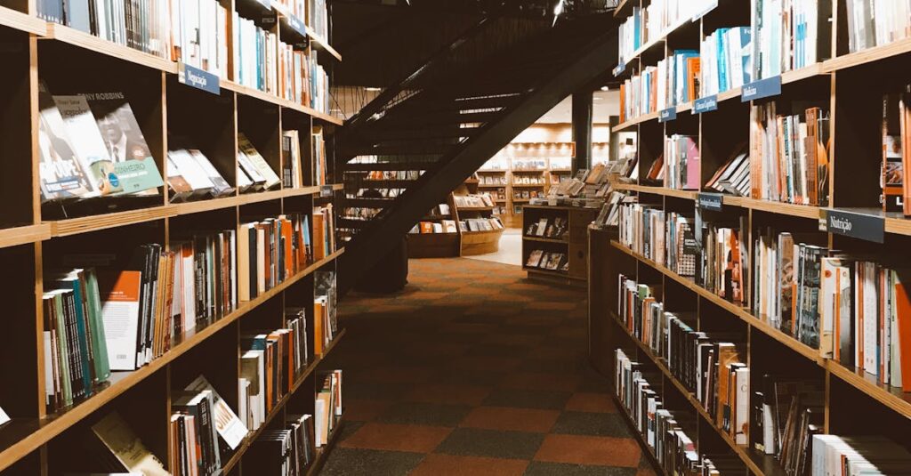 Warmly lit library aisle filled with a vast collection of books on wooden shelves.